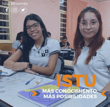 two girls are sitting at desks in a classroom with the words " más conocimiento mas posibilidades " on the bottom