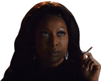 a woman is smoking a cigarette in a dark room with a white background