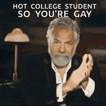 a man with a beard is clapping his hands with the words hot college student so you 're gay