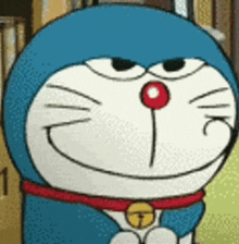 a close up of a cartoon character , doraemon , with a red nose and a bell around his neck .