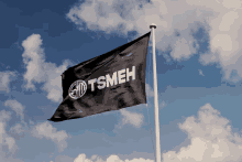 a black flag with the letters tsmeh on it