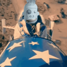 a robot with a mohawk is sitting on top of a blue flag with white stars