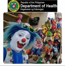 a group of clowns are sitting on a set of stairs in front of a sign that says republic of the philippines department of health