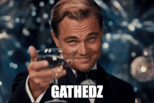 a man in a tuxedo is toasting with a glass of wine and the word gathedz is on the bottom