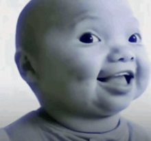 a baby making a funny face with his tongue hanging out