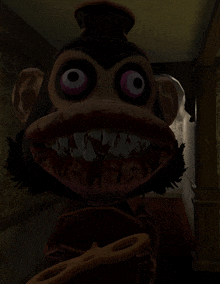 a stuffed monkey with a very large mouth and teeth