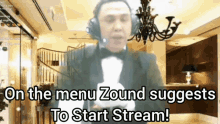 a man in a tuxedo is holding a stuffed animal with the words on the menu zound suggests to start stream