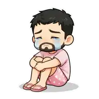 a man with a beard is crying while sitting on the ground