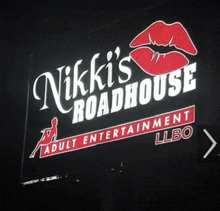 a sign that says nikki 's roadhouse adult entertainment llbo