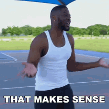 a man in a white tank top stands on a basketball court with the words that makes sense below him