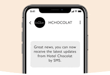 a cell phone with a message from hotel chocolat