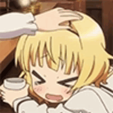 a person is petting a girl 's head while holding a cup .