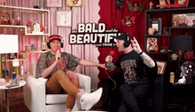 two men are sitting in front of a sign that says " the bald and the beautif "