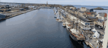 an aerial view of a harbor with boats docked and a building that says ' maritime ' on it