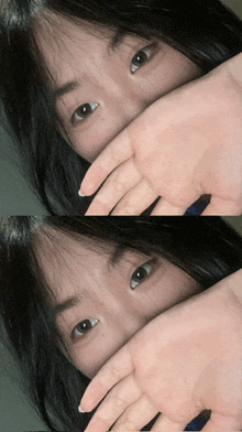 a woman covering her face with her hand in a selfie