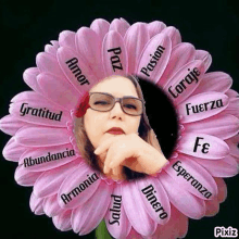 a woman wearing glasses is sitting in the middle of a pink flower surrounded by words .