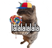 a cat wearing a hat and holding a lollipop with the words lalalalala on the bottom