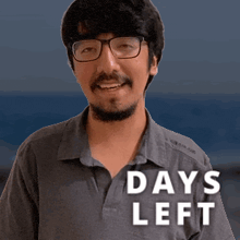 a man with glasses and a beard is smiling with the words days left behind him
