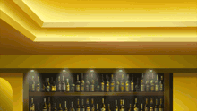 a shelf full of bottles of alcohol including one that says ' smirnoff ' on the label