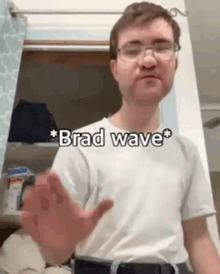 a man wearing glasses and a white shirt is standing in front of a closet and says brad wave .