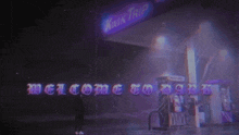 a welcome to dark sign is projected on a gas station