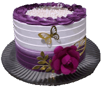 a purple and white cake with a butterfly and a flower