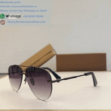 a pair of sunglasses with the website www.ecwholesaler.ru on the top