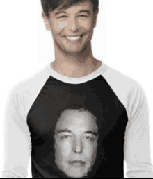 a man wearing a black and white baseball shirt with a picture of elon musk on it