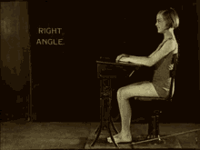 a black and white photo of a woman sitting at a desk with the words straight back written on the bottom