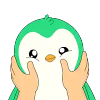 a green and white penguin is being held by a pair of hands