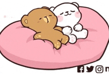 a couple of teddy bears are laying on a pink pillow .