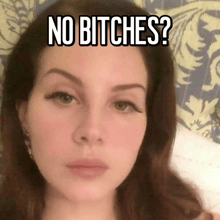 a close up of a woman 's face with the words " no bitches " on her face