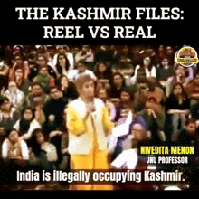 a man in a yellow jacket stands in front of a crowd and says " the kashmir files "
