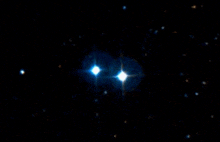 a pair of stars in the night sky with a black background