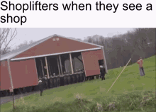 a group of people standing in front of a red barn with the words shoplifters when they see a shop on the bottom