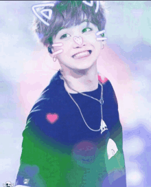 a young boy with cat ears and a heart on his face smiles