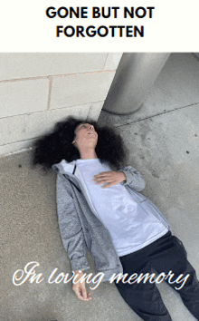 a person laying on the ground with the words gone but not forgotten in loving memory below them