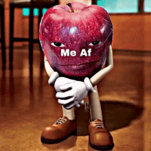 a cartoon apple with arms and legs is sitting on the floor and says me af