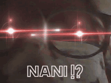 a person wearing glasses with red lights behind them and the word nani