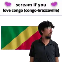 a man with glasses stands in front of a congo flag