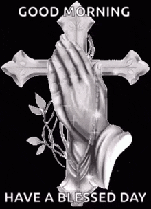 a picture of a cross with praying hands on it