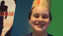 a young boy wearing a burger king crown