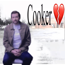 a man sits in front of the word cooker