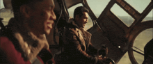 two men in a plane with the word hotdog on the bottom right