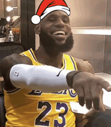 a basketball player wearing a santa hat and a jersey with the number 23 on it