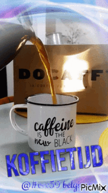 a cup that says caffeine is the new black on it