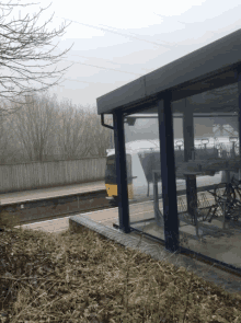 a train is parked at a train station with a bicycle rack in front of it