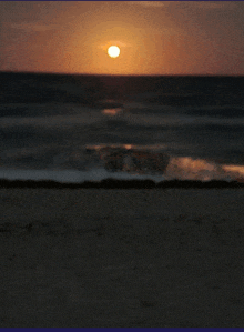 a sunset over the ocean with the sun shining brightly