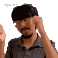a man with glasses and a beard is wearing a hat