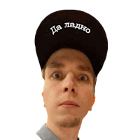 a man wearing a black hat that says да ладно